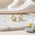 Gold-tone hoop earrings in luxurious setting